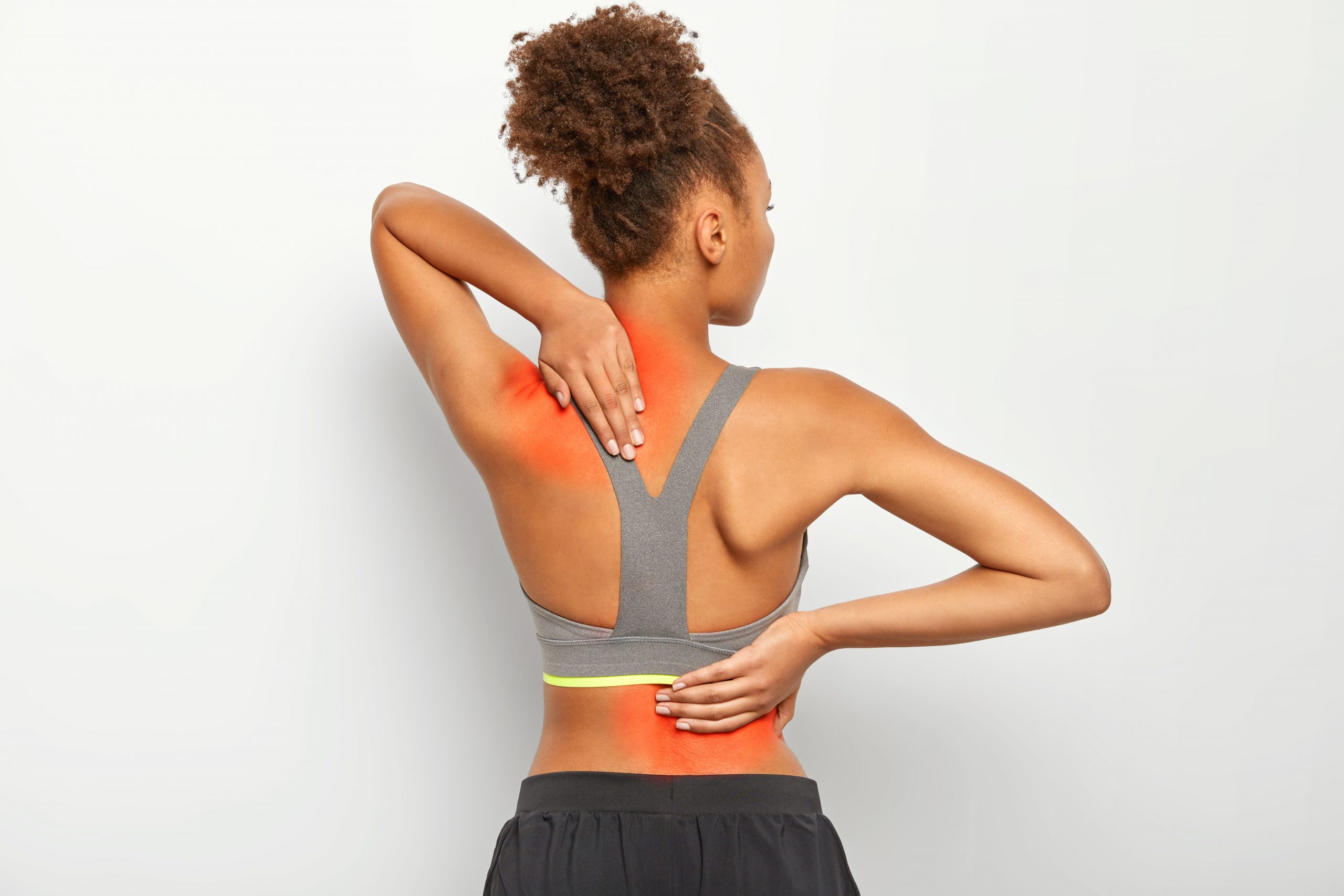 Woman showing upper back pain